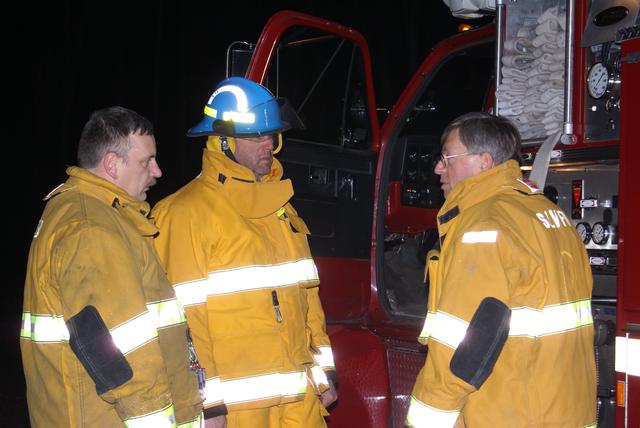 Lieutenant Bob Nadon instructs Jim Stinson and Bill Madden on pump panel of ETA-145, November 2010